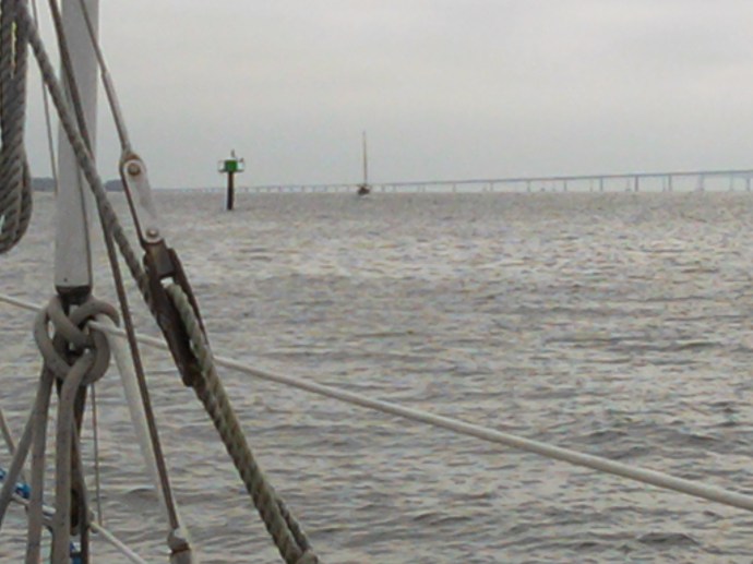 The crew of Plover bids farewell to Steadfast as she motors into the murky morning from Lake Ogleton.