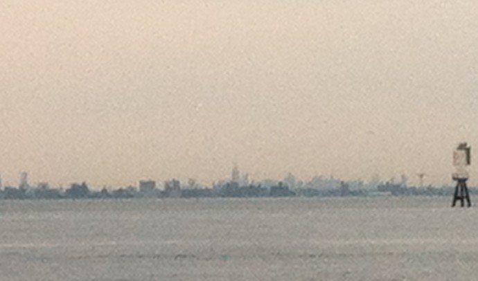 Turning Sandy Hook at dusk, the Manhattan skyline is barely discernible but unmistakeable nonetheless.