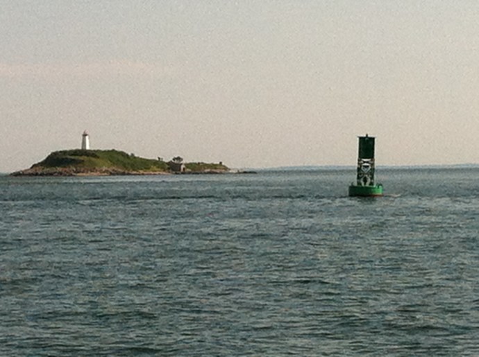 Even on a calm day, the current's enough to set the buoy to listing off Fisher Island.