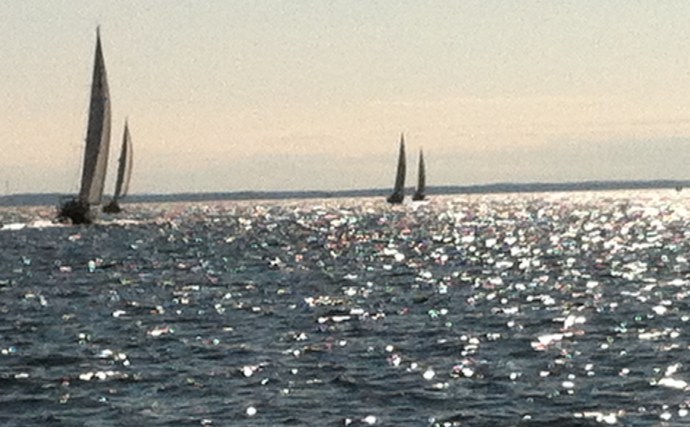 Lobster pots are hard to pick-out heading into the glare of the early morning sun out of Rockland, ME.