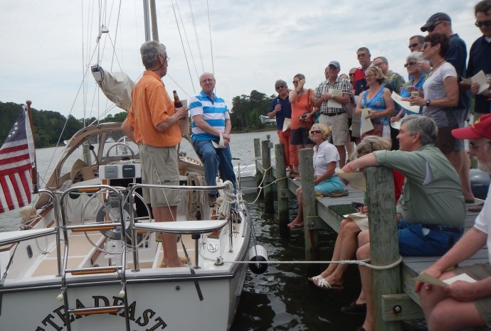 On board with the crew, Ray prepares to lead the blessing and reading of the Sailor's 23rd Psalm.