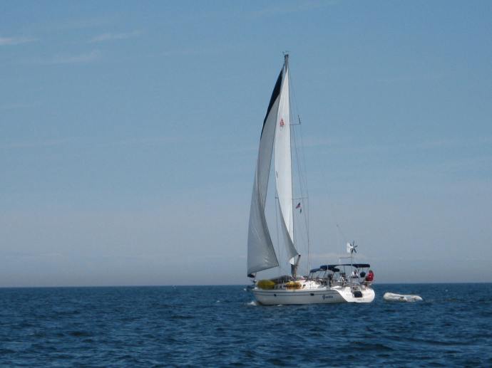 With all sail set, the Catalina 42 Gertie glides up the Jersey Shore.
