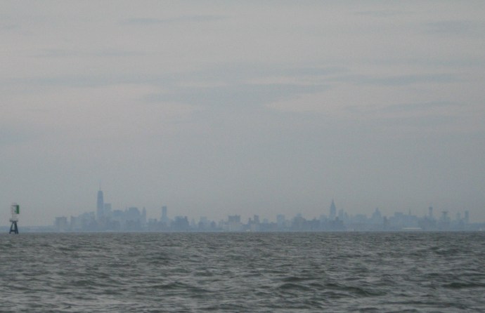 Even hidden behind an evening haze, the skyline of Manhattan is unmistakable.