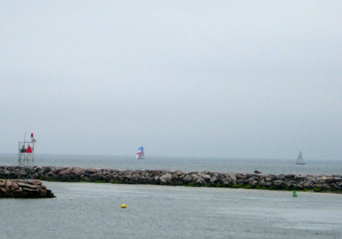 Part of the fleet passes the breakwater at Old Harbor during the round-the-island event that is part of BI Race Week.