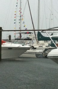 Rain and fog shroud the harbor but, so far, that's all Arthur's up to in New Bedford.