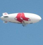 The Hood Dairy blimp hovered over the festivities for the Canal's centennial.