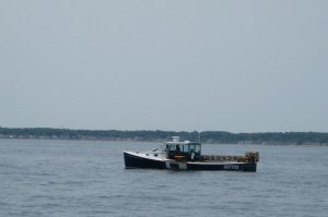 A lonesome lobster boat was the only traffic on Mass Bay.