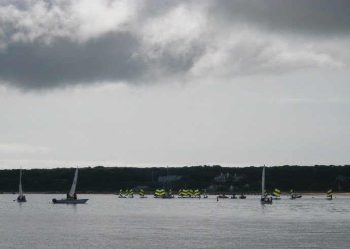 With so little wind, sailing camp crews resorted to paddling to make way.