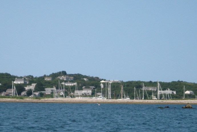 From outside, hulls in Cuttyhunk hide behind the sand spit.