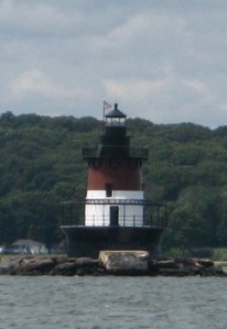The caisson-type Plum Beach Light stands under the west end of the Jamestown Bridge.