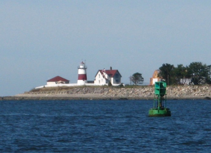 The brick-lined cast iron tower marks the shifting sand bars and strong currents where the Housatonic River meets Long Island Sound at Stratford Point.