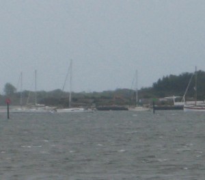 The harbor anchorage was full despite the strong wind.