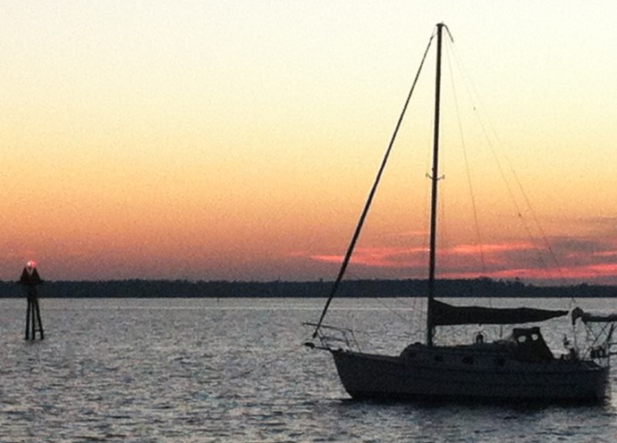 Steadfast lays to her anchor just outside the channel off Bear Point.