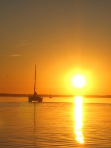 Two Fish turns down the Pasquotank into a rising sun.
