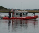 Coast Guardsmen patrol the safety zone.