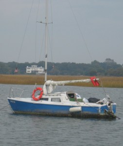 A handy-man's special lies to anchor just off the channel.