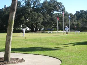 One must be properly outfitted for croquet on the lawn.