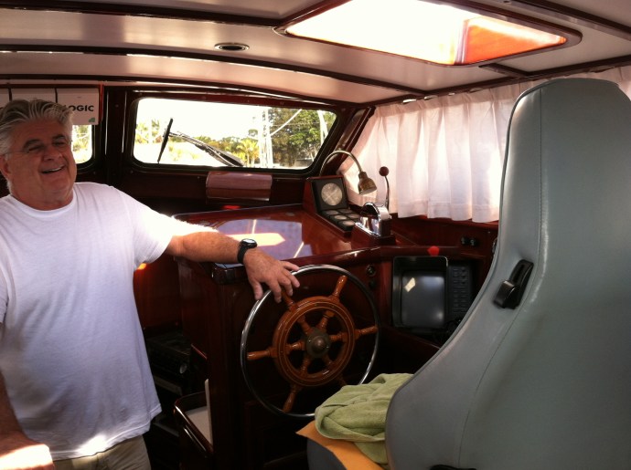 Yves shows off the Porsche bucket seat at the inside helm station.