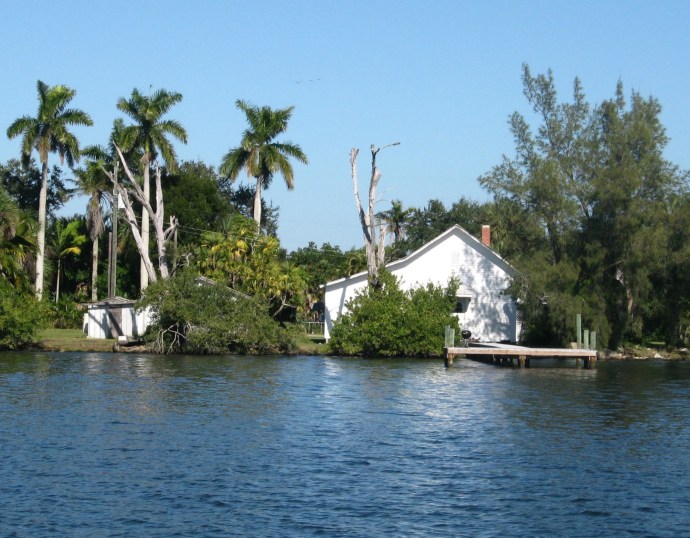 A humble home sits not far from pricey condos.