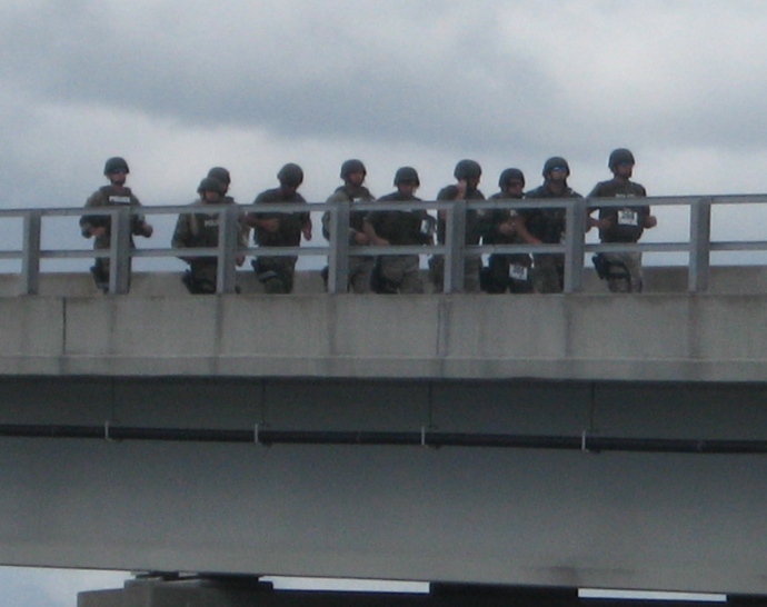 A squad of SWAT Team members crosses back over the Edison Bridge as part of a fund-raiser for Lead The Way.