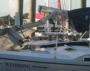 Torn tramp and a tangle of rigging wire on mangled spars.