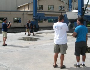 Patrick turns videographer while John and Charlie confer.